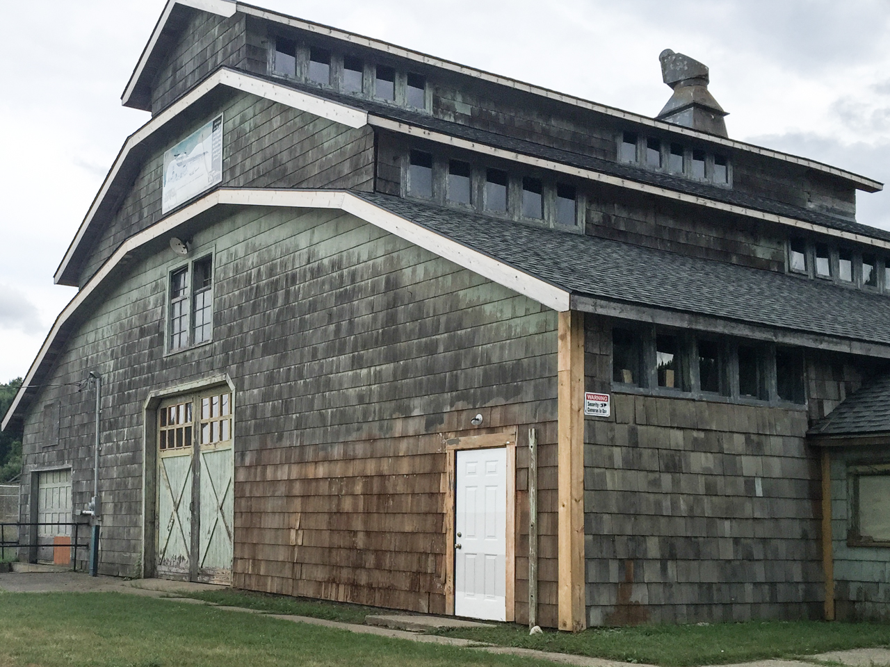 ABOVE: The Edsel Ford Barn in Highland State Recreation Area is having the old paint removed and new paint applied this summer of 2016.
