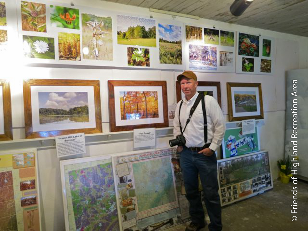 FOHRA volunteer Jay Fitzgerald and some of the Haven Hill photography on display at the Haven Hill Gate House..