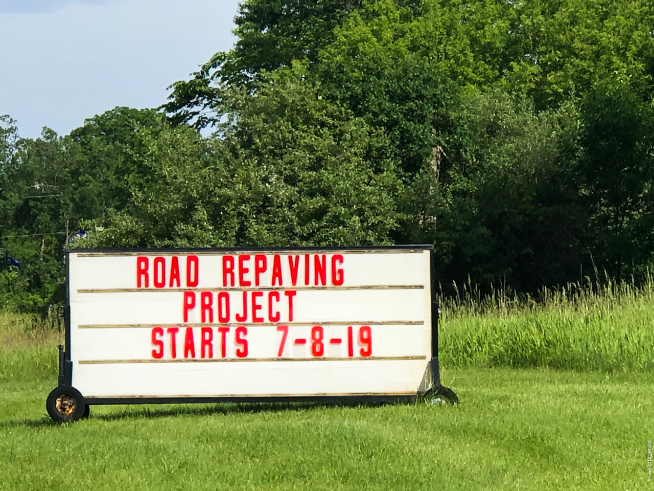 M-59 Highland Road sign announces the repaving project at Highland State Recreation Area.