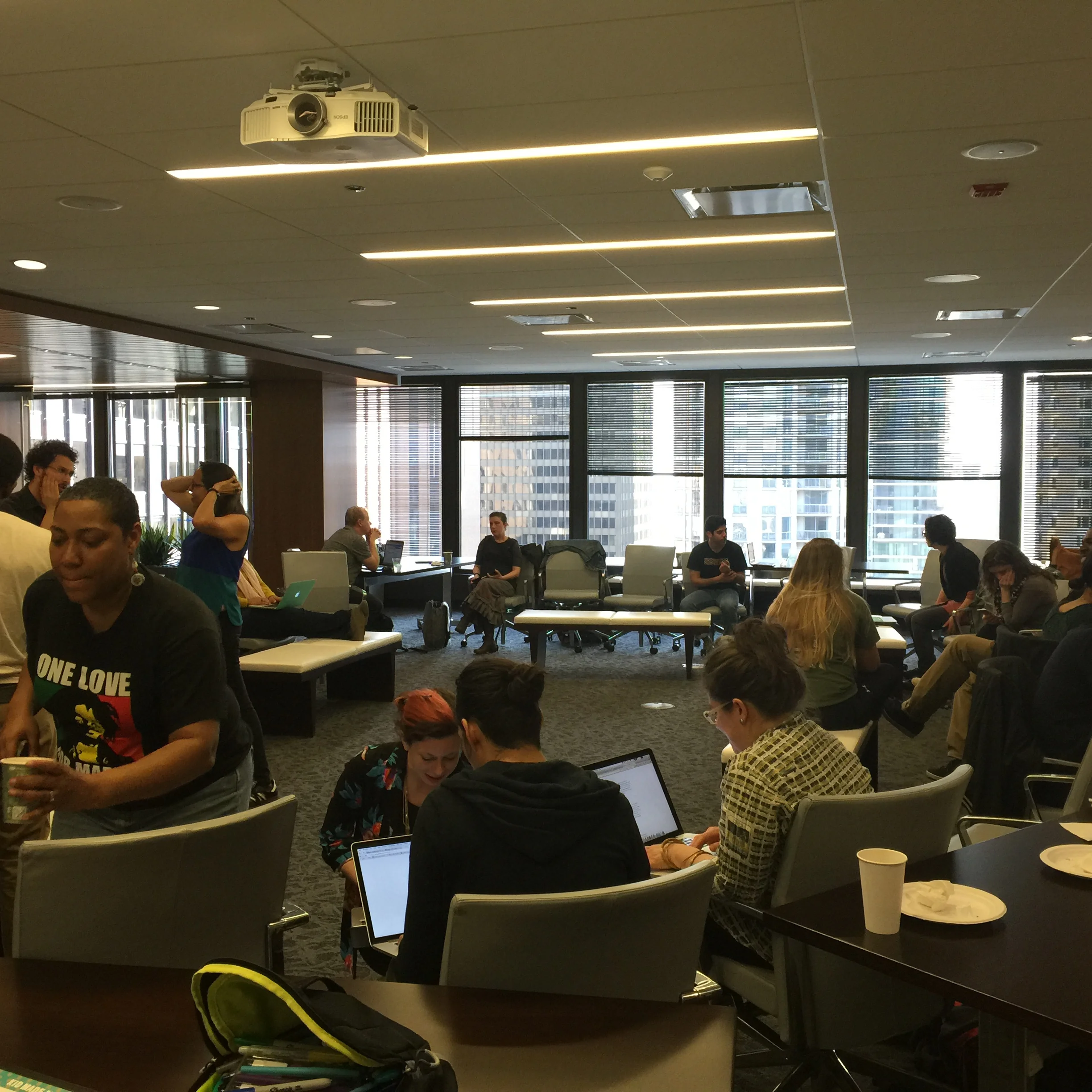 Technologists talking and snacking and documenting at the Chicago Community Trust.