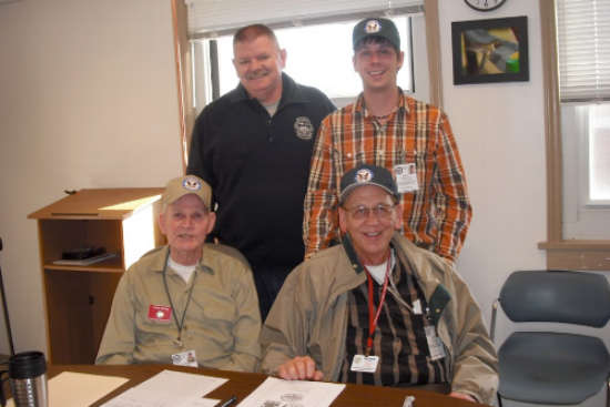 Bobby Clark (back left) poses with RACES volunteers Jason Gallimore (back right), Tom King (front left), and Dave Larsen (front right). Photo courtesy of Amy Ingram.