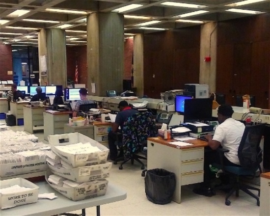 Boston election staff hard at work in the Boston City Hall. Photo by Kyron Owens.