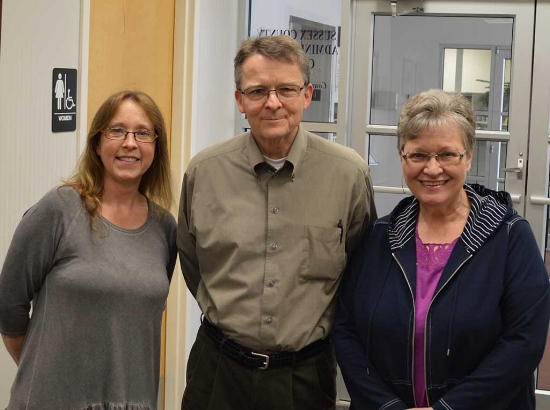 Web manager Thor Carlson flanked by Ellen and Marge. Photo by John Williams.