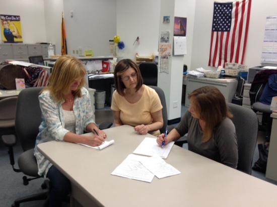Judy Lynch, Dorleen Donahue, and Ellen Griffiths compose scripts for the videos. Photo by Marge McCabe.