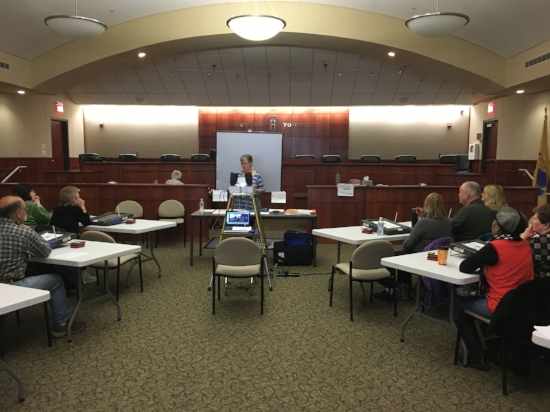 Marge Lake McCabe leads a poll worker training class. Photo by Kimberly Sidoti.