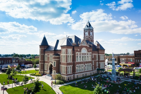 The Hardin County courthouse with local citizens relaxing in the lawn. Photo by Micah Cutler.