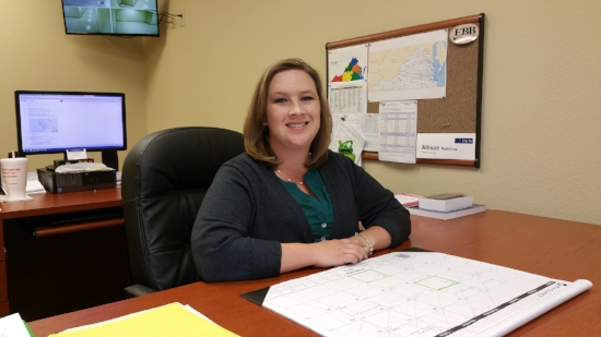 Allison J. Robbins sitting at her office desk. Photo courtesy of Allison J. Robbins.