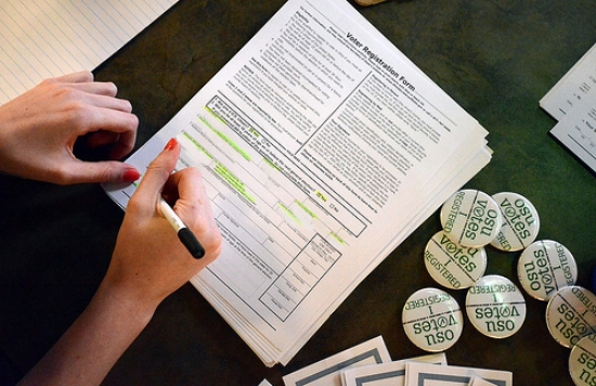 A citizen completes a form at an Ohio State voter registration drive. Photo courtesy of Christine A. Fulara.