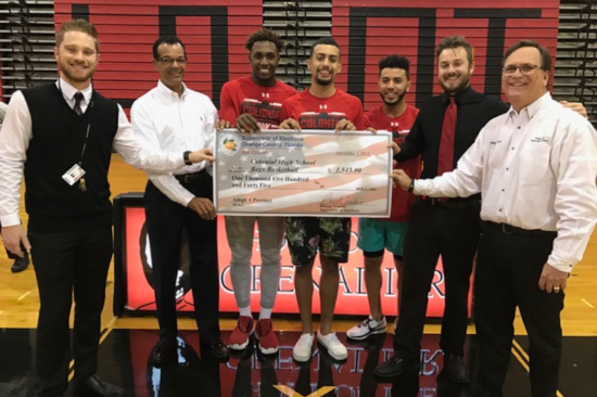 Colonial High School Boys Basketball representatives receive their Adopt-a-Precinct check from Bill Cowles (far right) and Timothy Frazier (second from left). Photo courtesy of the Orange County Supervisor of Elections.