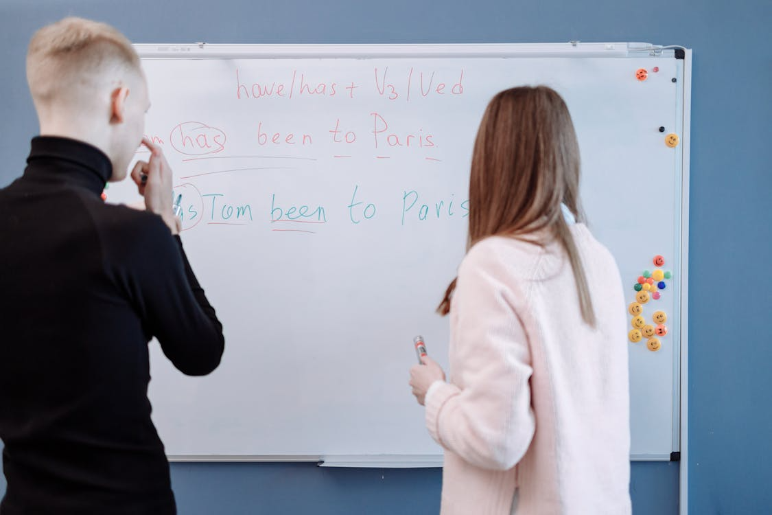 A teacher teaching English to a student