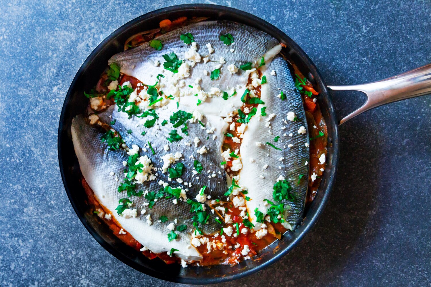 Moroccan spiced fish fillets and bell peppers in tomato sauce