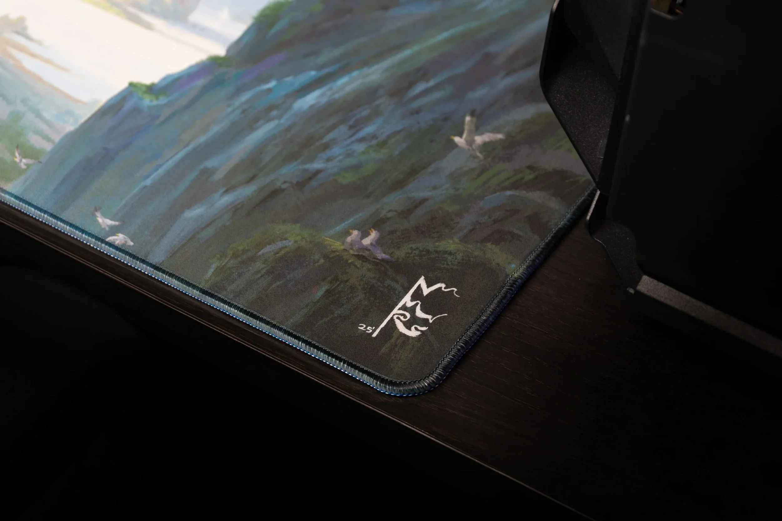nick-ragetli-lake-of-laugg-deskmat-artist-signature-corner.jpg
