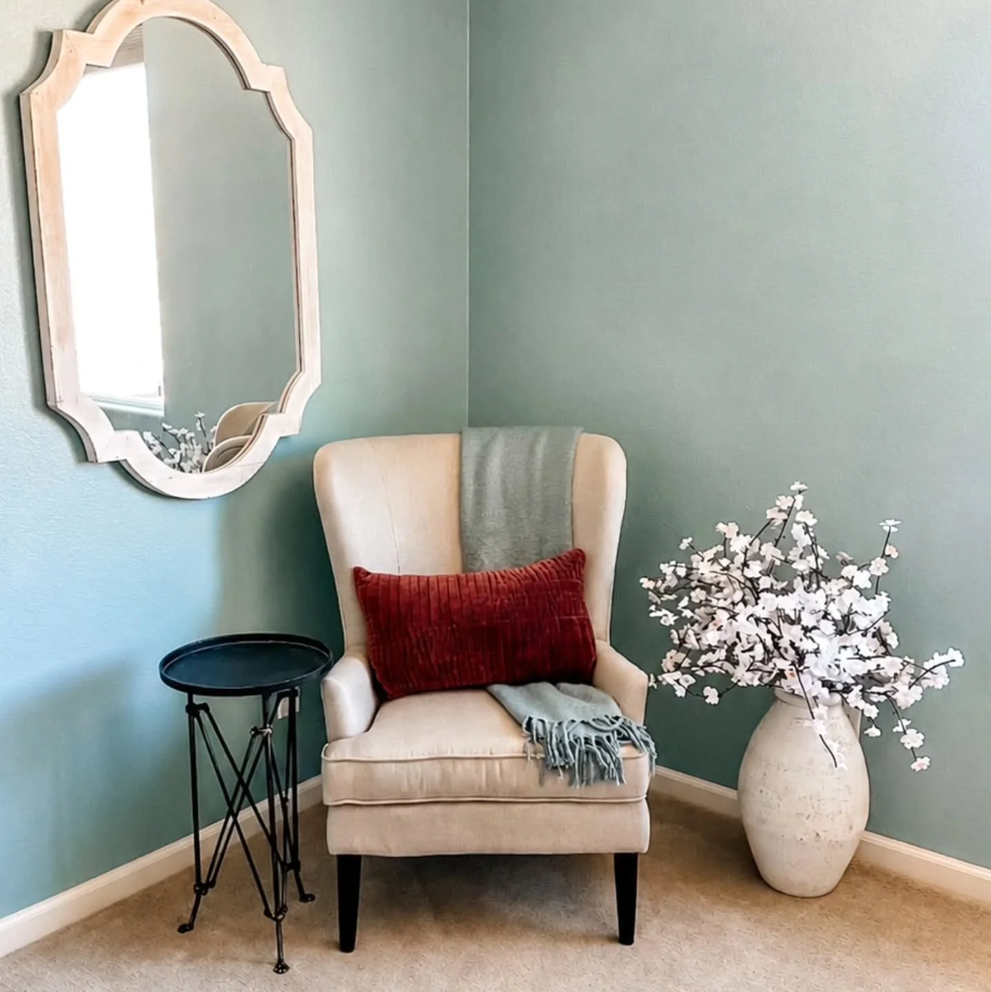 When staging a home, we love finding those overlooked spaces and giving them purpose. A cozy chair, a soft throw, a small table, and suddenly an empty corner becomes a charming reading nook buyers can picture themselves enjoying. It's not about filli