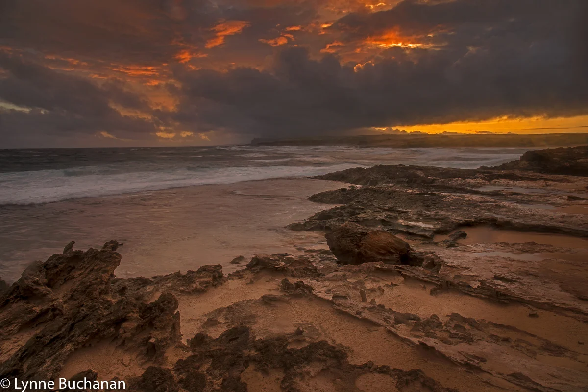 Mo'Omomi Beach on Fire with the Napali Cliffs in the Distance