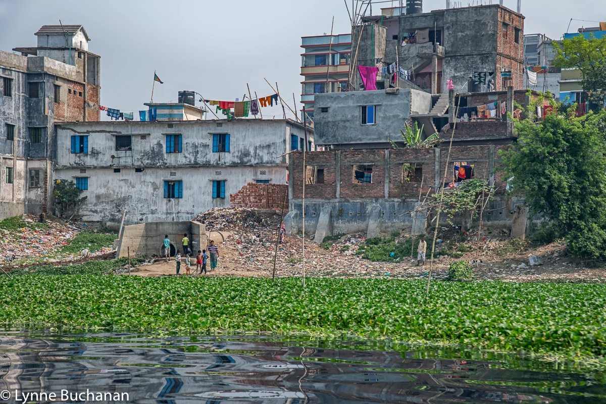 Buriganga River Children Congregating in front of a Drain Pipe