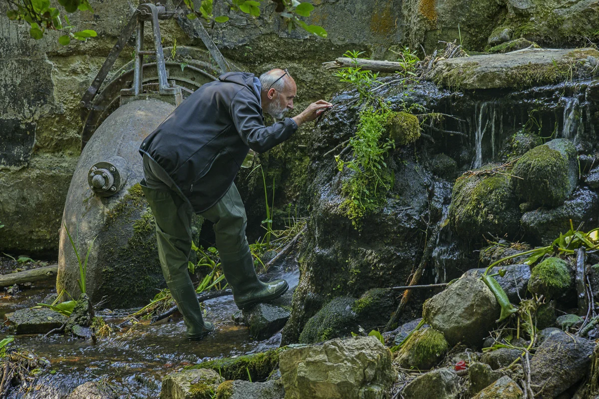 Marek collecting moss and samples