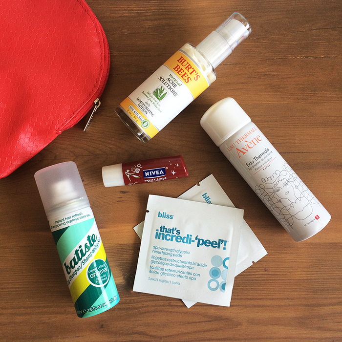Clockwise: (1) Burt's Bees Natural Acne Solutions Daily Moisturizing Lotion, (2) Avene Eau Thermale, (3) Bliss That's Incredi-‘peel’! Glycolic Resurfacing Pads, (4) Batiste Dry Shampoo In 'Original', and (5) Nivea Fruity Shine Lip Care