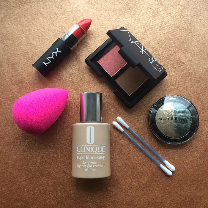 Clockwise From The Top: 1) NYX Matte Lipstick In 'Indie Flick', 2) NARS Blush/Bronzer Duo, 3) Maybelline Hypercosmos Eyeshadow In 'CH-1' , 4) Clinique Superfit Foundation, and 5) beautyblender