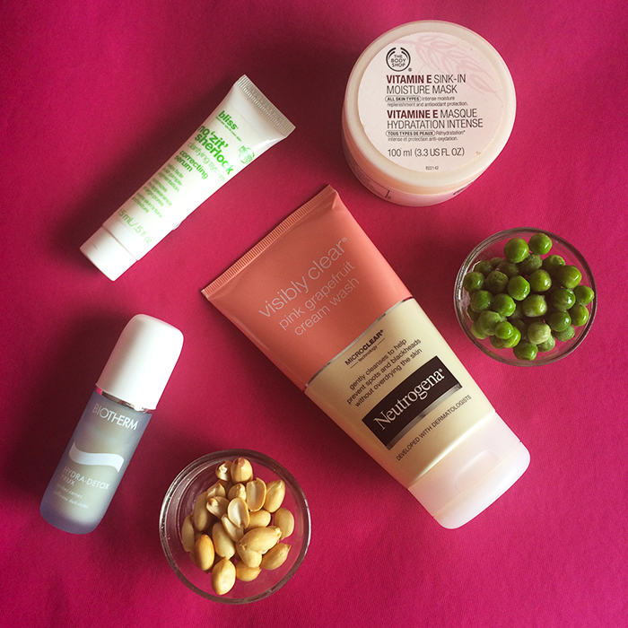 Clockwise From The Top: 1) Bliss No 'Zit' Sherlock Serum, 2) The Body Shop Vitamin E Sink-In Moisture Mask, 3) Neutrogena Visibly Clear Pink Grapefruit Cream Wash, and 4) Biotherm Hydra Detox Yeux Eye Cream