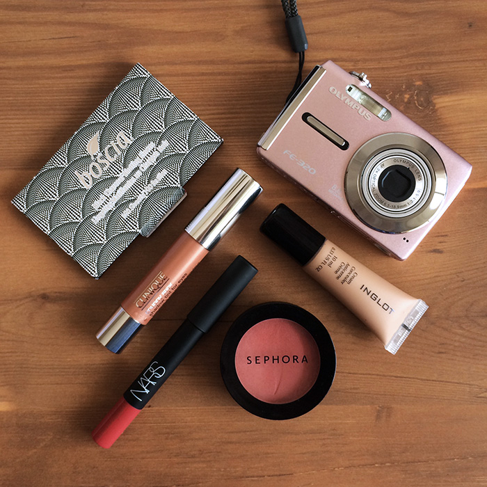 Clockwise From Top: 1) Boscia Black Charcoal Blotting Linens, 2) Inglot Cream Concealer, 3) Sephora Blush In 'Rose Glow', 4) NARS Velvet Matte Lip Pencil In 'Dolce Vita', and 5) Clinique Chubby Stick Shadow Tint For Eyes In 'Ample Amber'