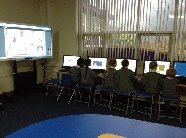 Year 2 creating a PowerPoint to retell the story of Jesus' birth in the Media Suite.
