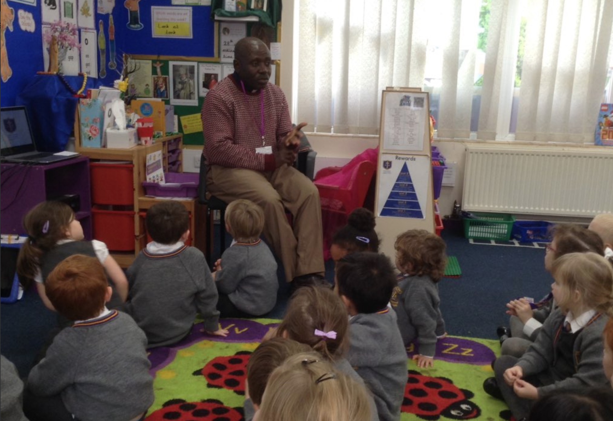 Photo: Fr. Emmanuel came to visit Reception class at Holy Name and we said part of our rosary decade together.