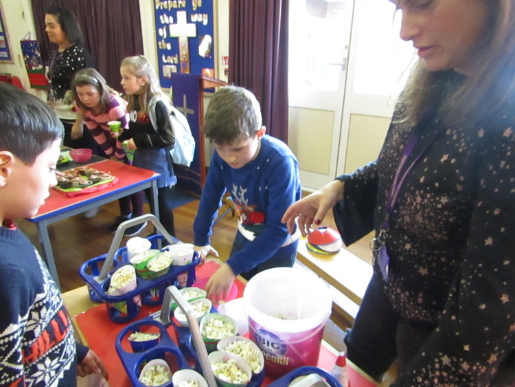The entrepreneurs of Year 5 sold Christmas cones of popcorn for the fair.