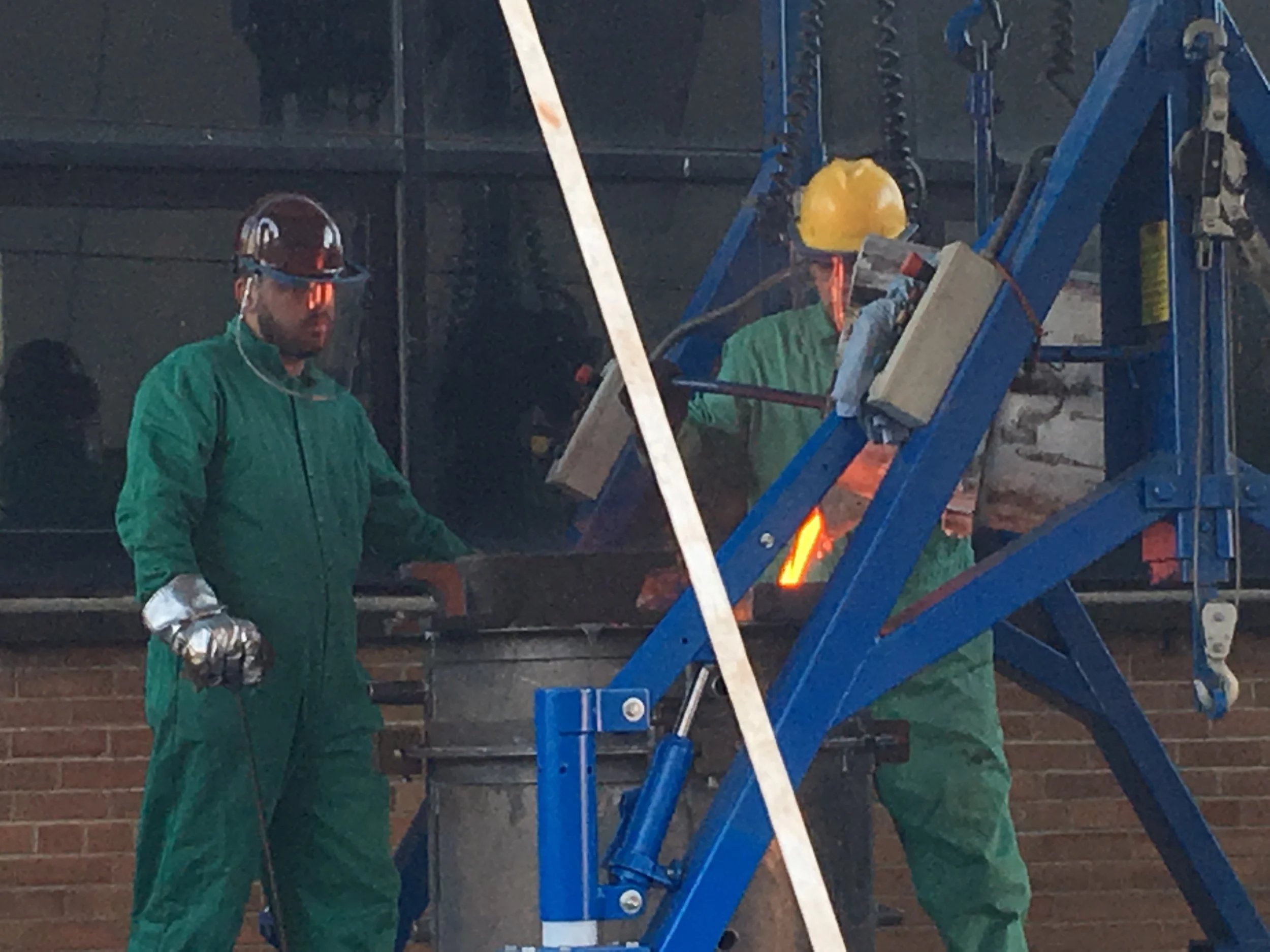 The molten bronze is poured into the mold. The mold will be opened in a few days. 