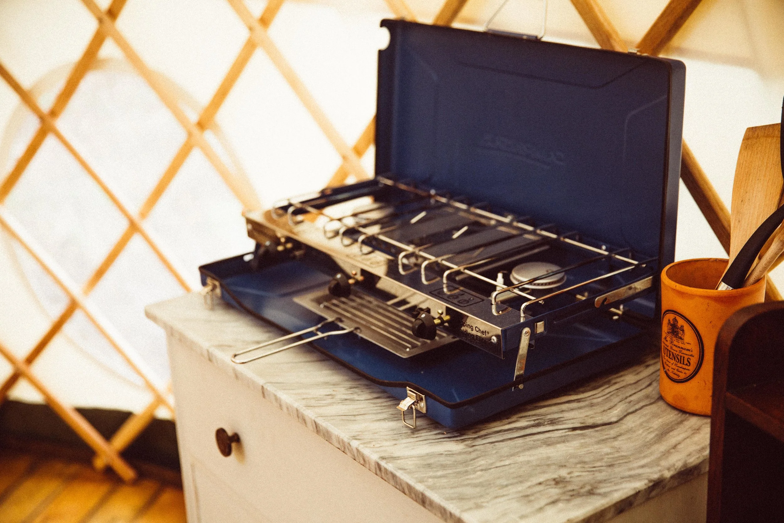 Gas stove with grill on kitchen unit