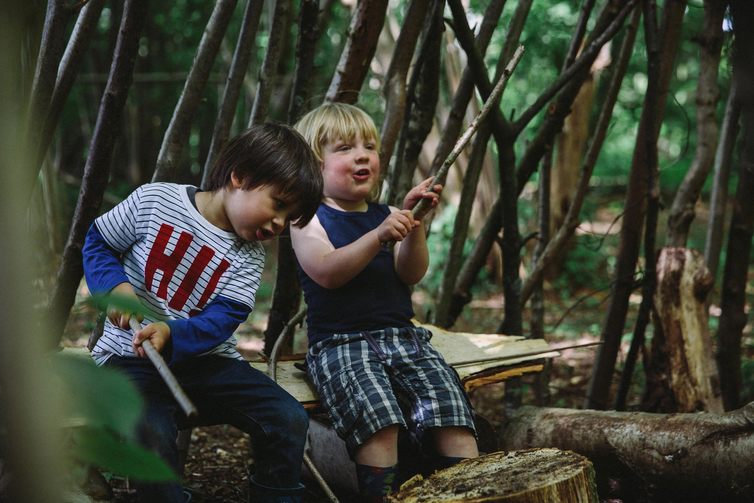 Children den building, playing in the woods, reconnecting with nature