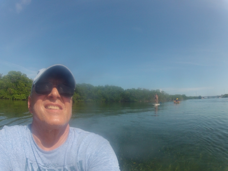 My dad taking a GoPRo selfie…me PADDLE BOARDING in the background. Woohoo!