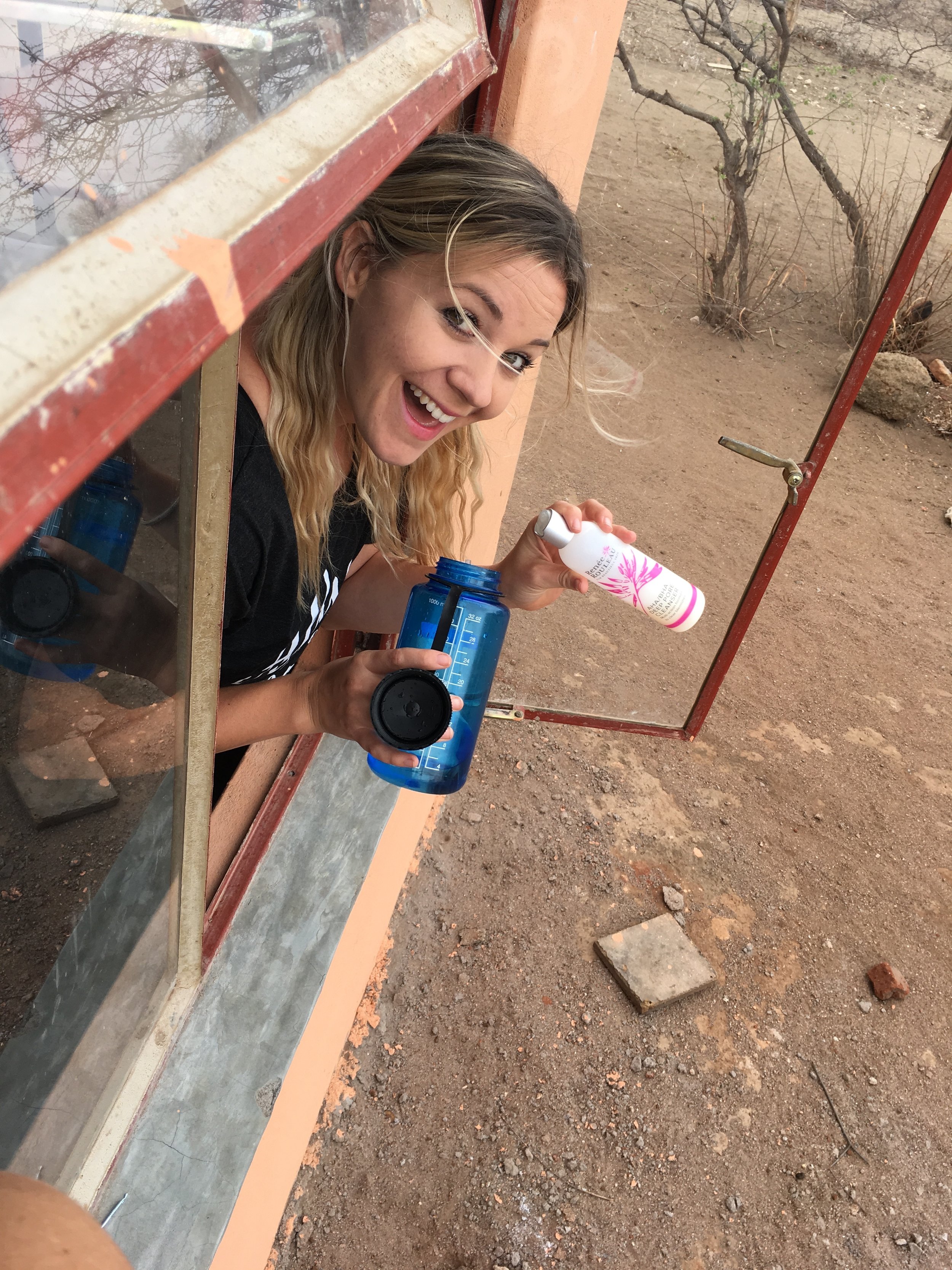 Kate washing her face with a nalgene & her fav Renee Rouleau face wash!