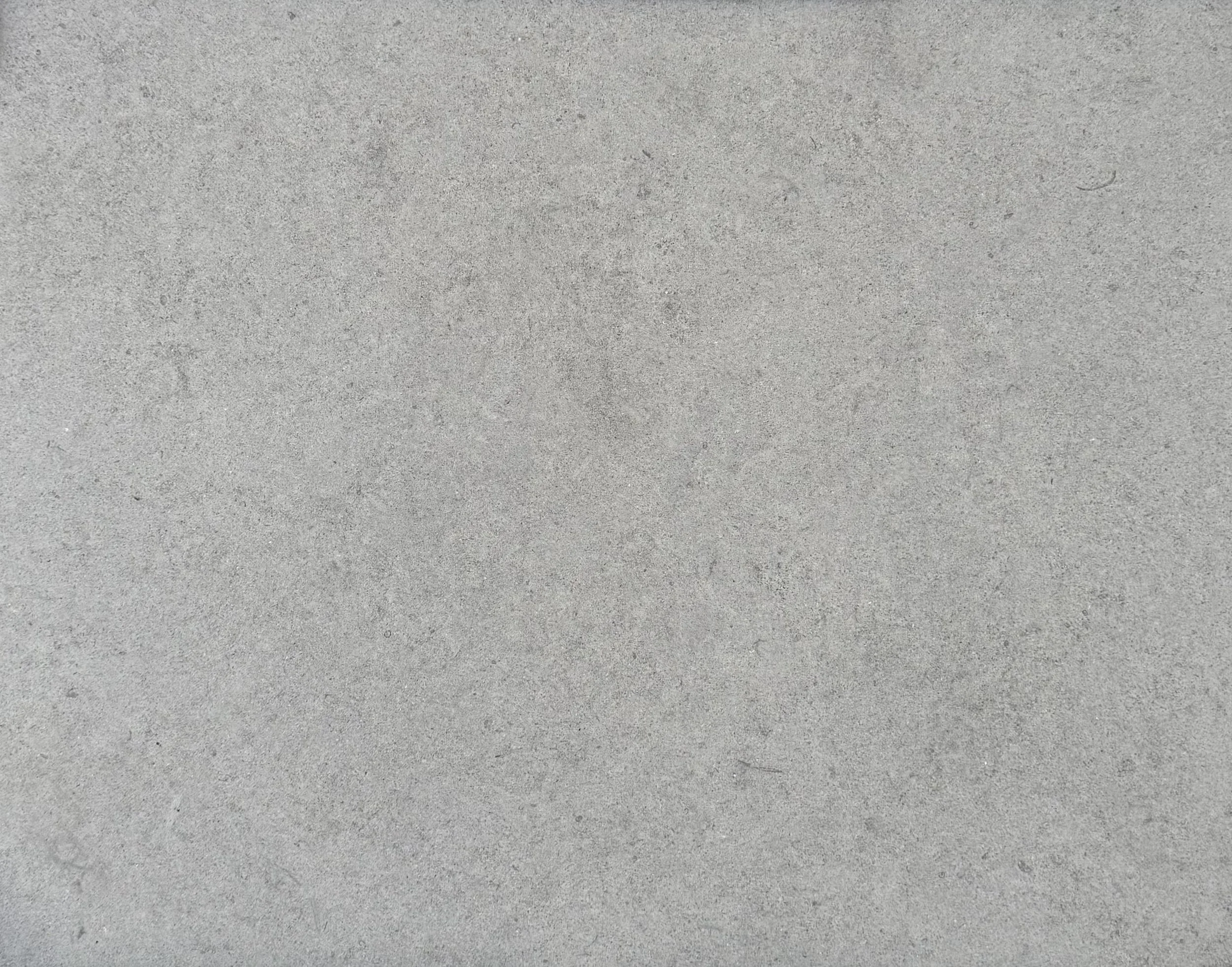 A close-up of gray concrete pavement.