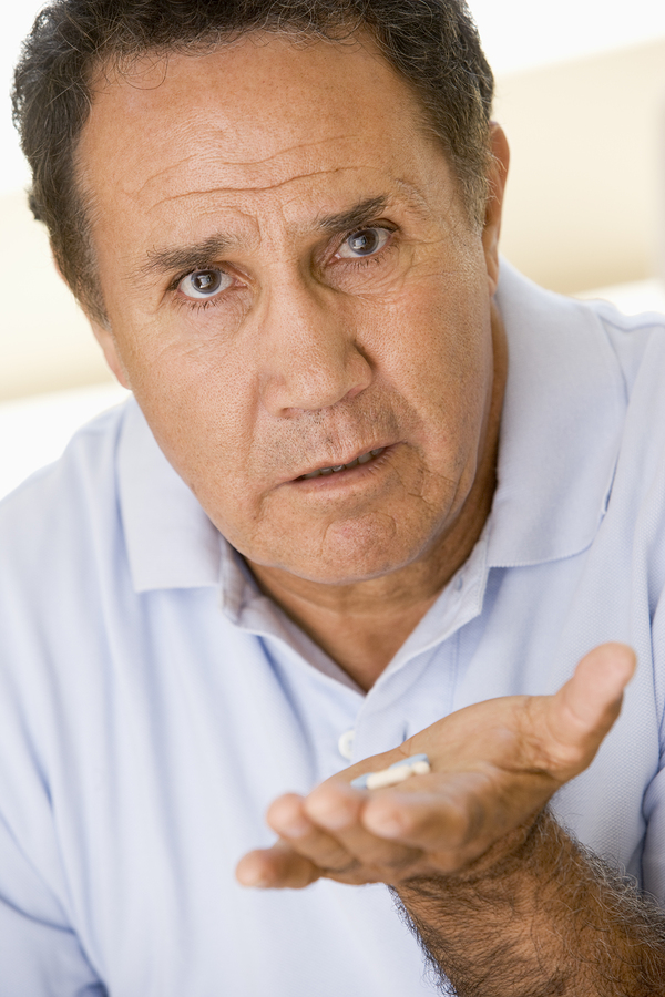 bigstock-man-taking-medication-13886486.jpg