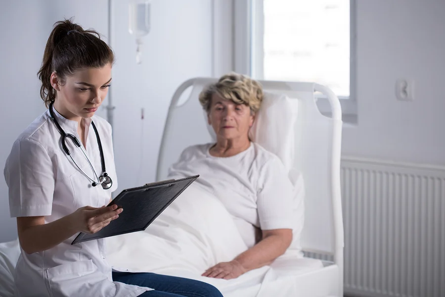 bigstock-Doctor-With-Elderly-Hospice-Pa-115354478.jpg
