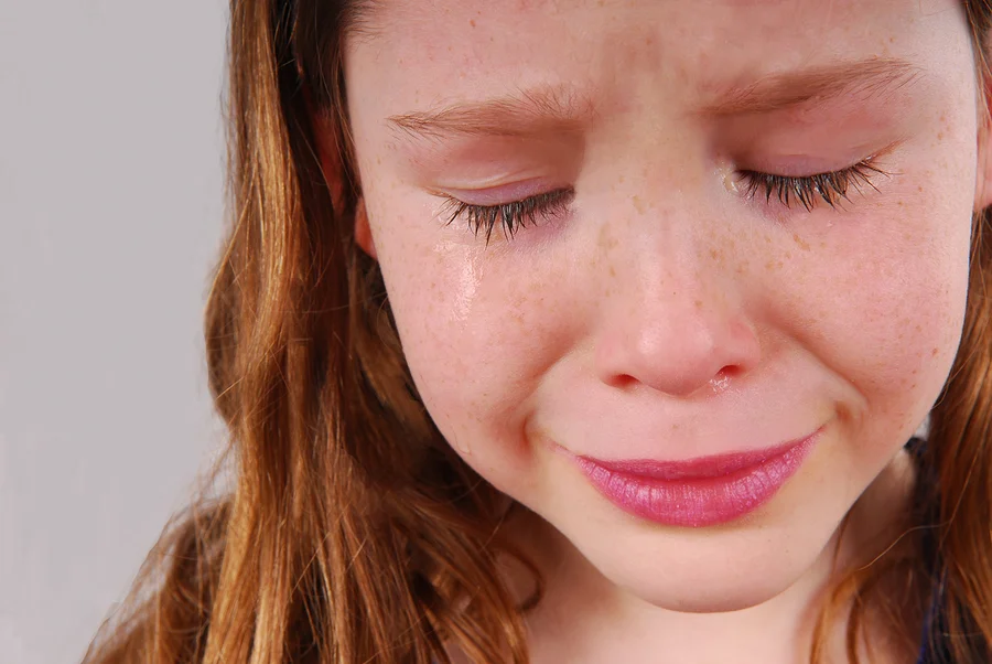 bigstock-Young-girl-upset-crying-with--25717613.jpg