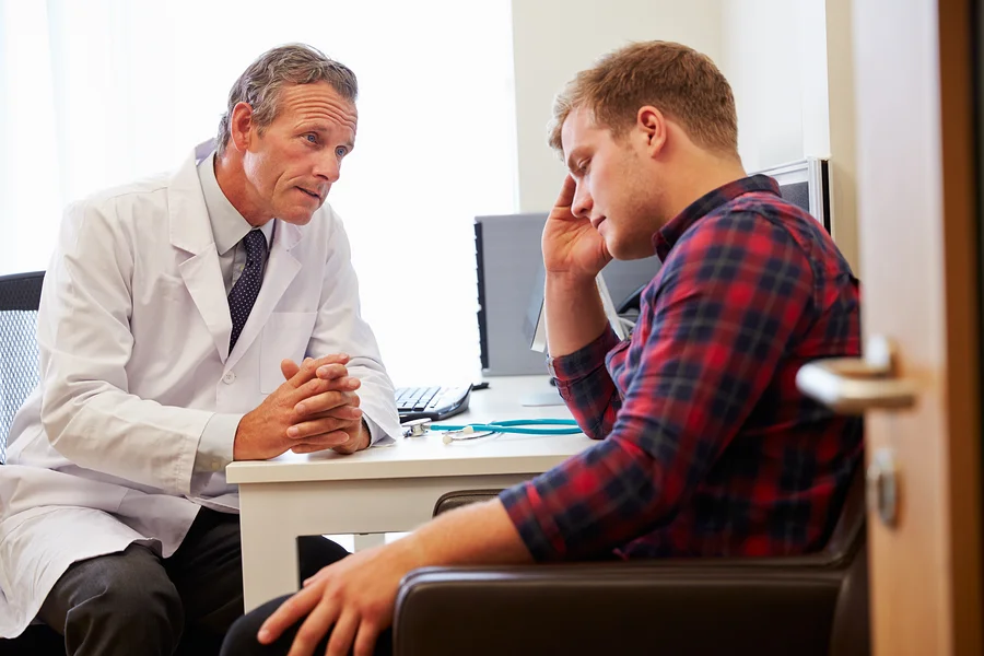 bigstock-Doctor-Treating-Male-Patient-S-102015677.jpg