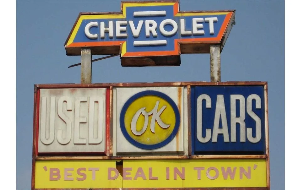vintage used cars sign