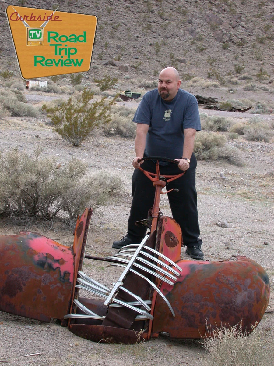 Your Curbside publisher with one of the many pieces of cars that are rotting away in the desert climate.