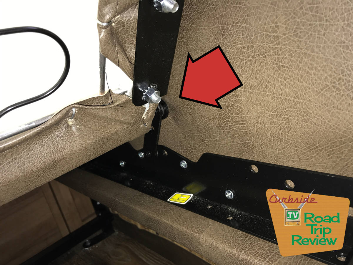 Here you can see how the jackknife hinge comes directly into contact with the upholstery on the armrest of the couch. 