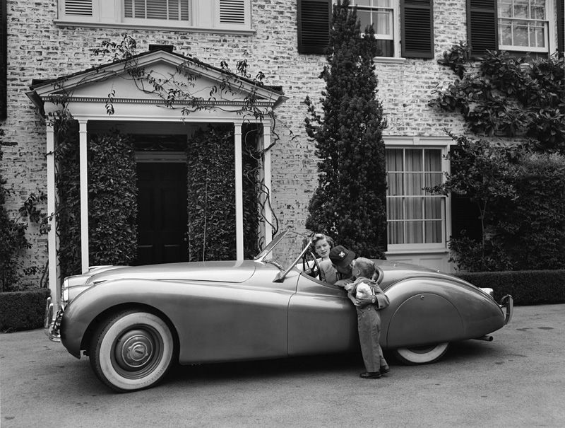 Actor Humphrey Bogart and his Jaguar XK-120