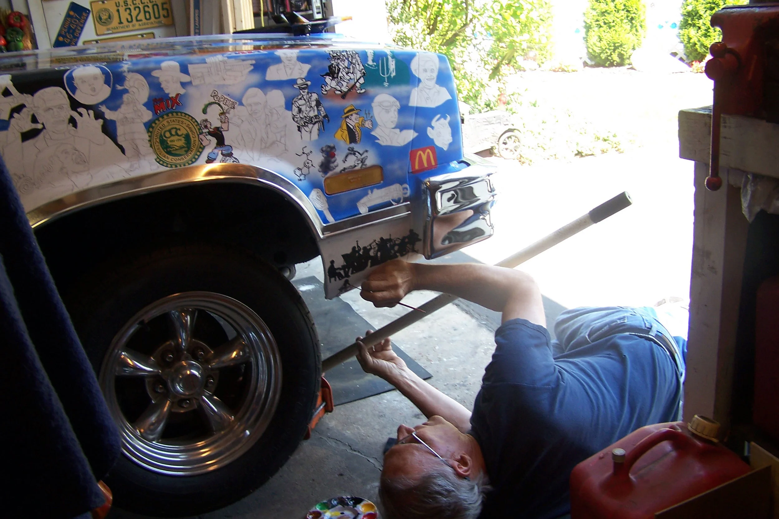 A contortionist’s job is what it takes to accomplish the minute details in difficult spots on the El Camino here showing Robert Luczun detailing the underside of a fender on the car.
