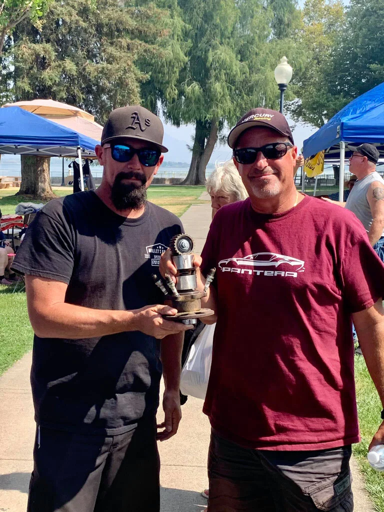 Paul Malley (L) from Malley’s Rallys giving the award to Larry Laino for his DeThomaso Pantera.  
