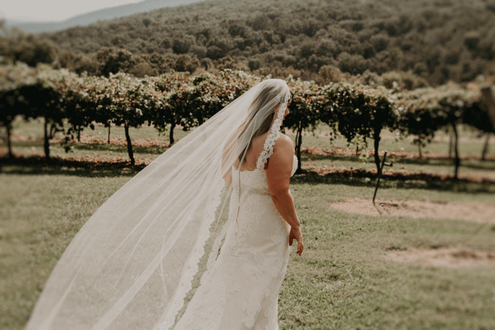 Bride reveals herself to groom for the first look in her wedding gown