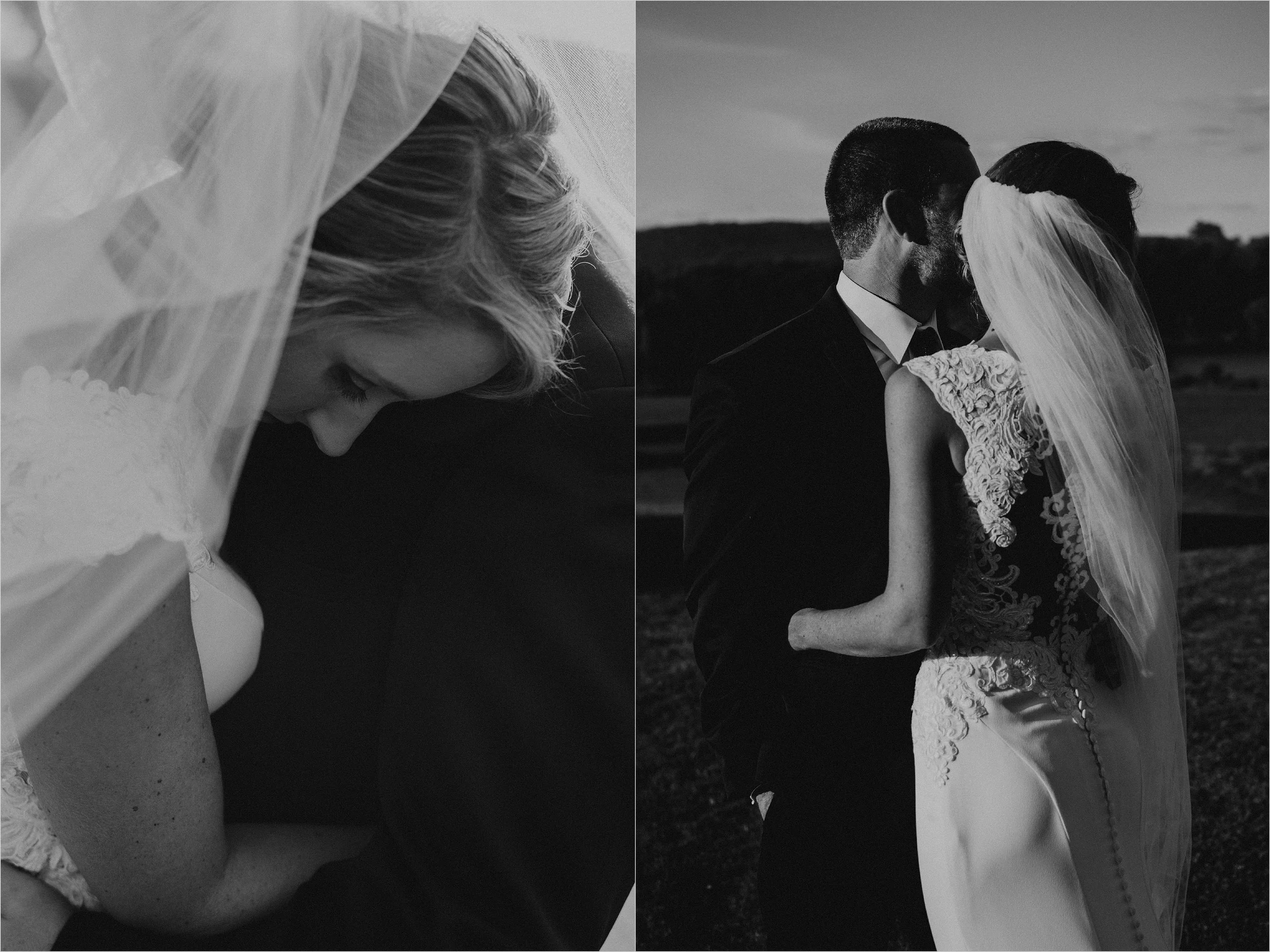 Bride embraces her groom as her cathedral veils blows in the wind around them