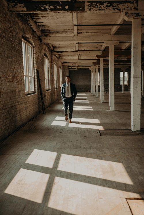 Moving image of Joe walking through the warehouse space on the fourth floor of Company 251