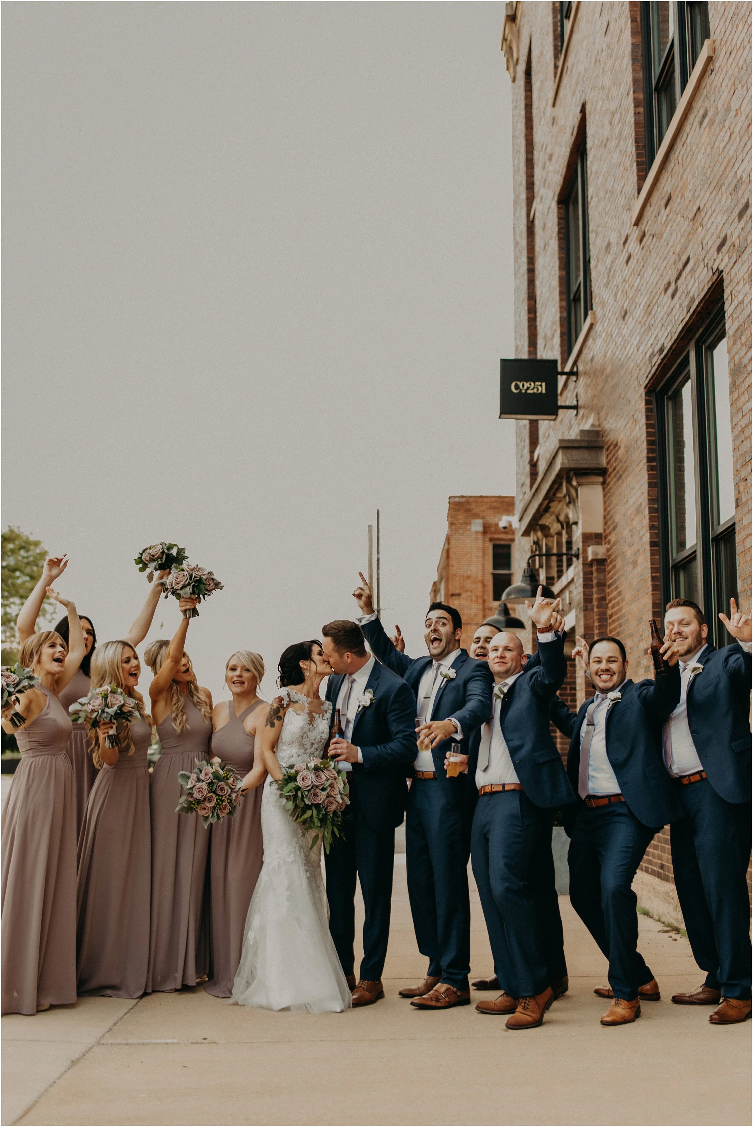 Wedding party celebrates outside of Company 251