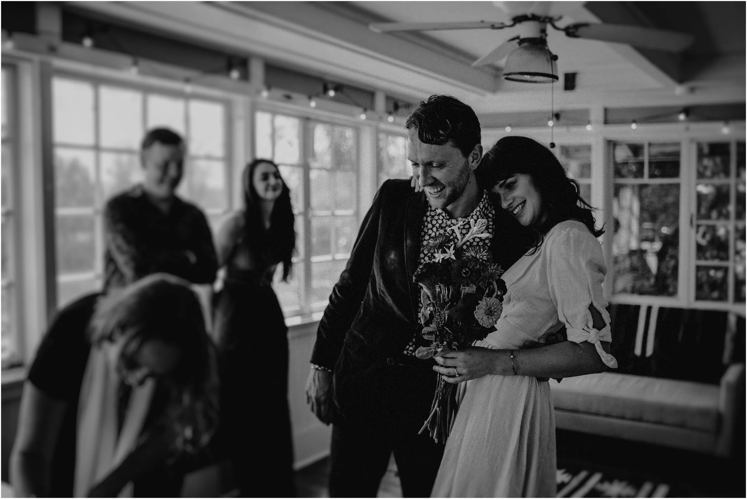 Preparing to sign the marriage license in the sunroom of their Nashville cottage