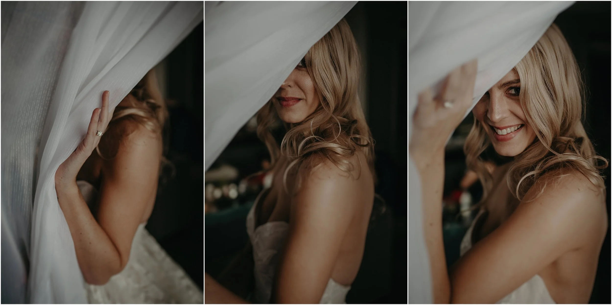 The bride peeks through the curtain’s of the hotel room