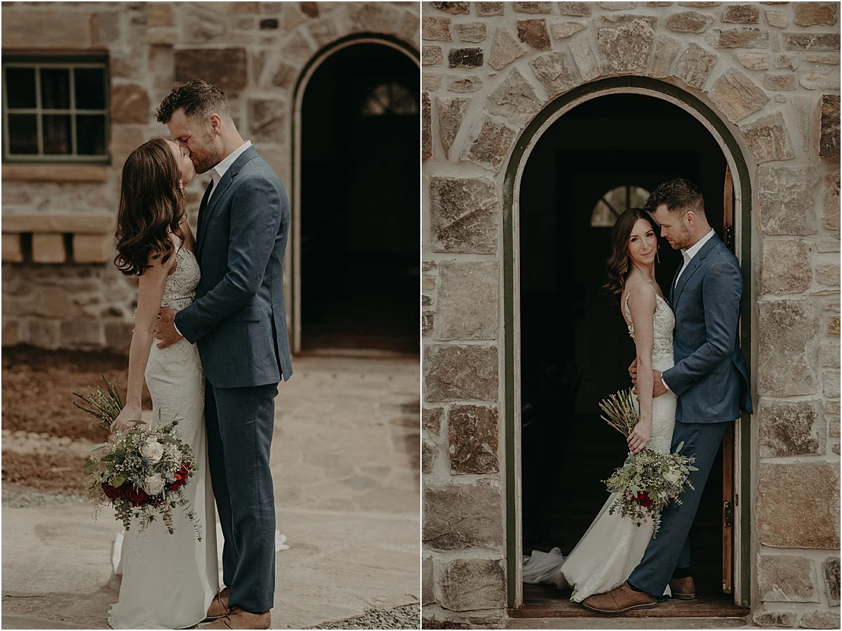 bride and groom embracing in front of brick cottage in georgia
